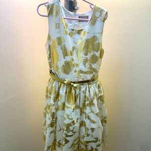 Size 10-12 golden and white with gold bow belt.